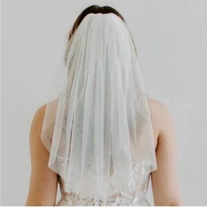 Shoulder length white veil- never worn or used, changed my dress to ivory.